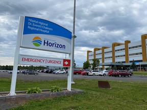A sign near the entrance of the Dr. Everett Chalmers Hospital in Fredericton. The hospital saw the death of a patient in its ER in July.