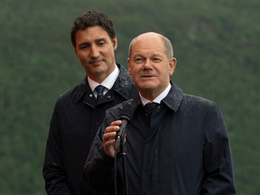 Canadian Prime Minister Justin Trudeau looks on as German Chancellor Olaf Scholz responds to a question on Tuesday, August 23, 2022 in Stephenville, Newfoundland and Labrador.  THE CANADIAN PRESS/Adrian Wyld