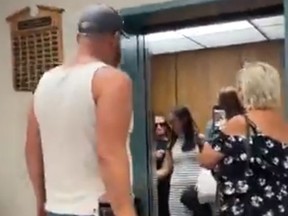A still image from a video posted to social media shows Deputy Prime Minister Chrystia Freeland being verbally accosted by a man as she visits Grande Prairie, Alta., on Aug. 26, 2022.