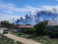 Smoke rises after explosions were heard from the direction of a Russian military airbase near Novofedorivka, Crimea, August 9, 2022.