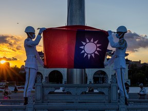 The Flag-Lowering Ceremony takes place at Liberty Square on August 09, 2022 in Taipei, Taiwan. Taiwan's military held a live-fire drill in response to China's recent live-fire drills in waters close to those claimed by Taiwan. (Photo by Annabelle Chih/Getty Images)