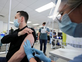A man is vaccinated at a monkeypox vaccination clinic run by public health authorities in Montreal on June 6, 2022.