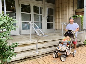 Henry and son in front of steps.   SUPPLIED