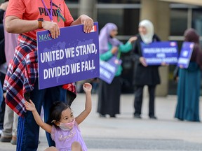 People attend an anti-Islamophobia rally sponsored by the Muslim Association of Canada (MAC) in Toronto on June 18, 2021. MAC executive Sharaf Sharafeldin rejects accusations that the association has provided a platform for speakers who spread hate.