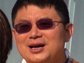 Canadian citizen James Xiao (Xiao Jianhua), who has been sentenced to 13 years in prison by China, is seen in a file photo from December 2013. Abducted from a Hong Kong hotel room, the successful businessman had been held incommunicado for nearly six years until he reappeared last month in a Shanghai courtroom.