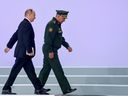 Russian President Vladimir Putin and Defense Minister Sergei Shoigu attend Army-2022 opening ceremonies at the Patriot Exhibition and Congress Center in Moscow region, Russia August 15, 2022. REUTERS /Maxim Shemetov