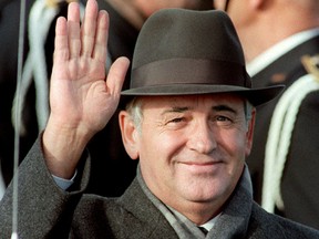 Soviet leader Mikhail Gorbachev waves as he arrives in Iceland for meetings with U.S. President Ronald Reagan in October 1986.