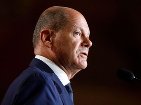 German Chancellor Olaf Scholz speaks during a welcome dinner hosted by Prime Minister Justin Trudeau at the Royal Ontario Museum in Toronto on Aug. 22, 2022, during Scholz's three-day visit to Canada.
