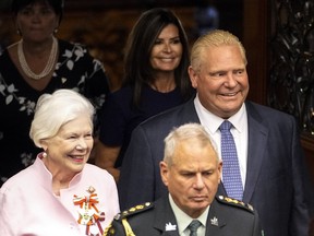 Ontario Lt.-Governor Elizabeth Dowdeswell, left, and Ontario Premier Doug Ford enter the legislative chamber before the Throne Speech at Queens Park in Toronto, on August 9, 2022.