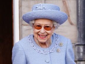 Queen Elizabeth II  attends the Queen's Body Guard for Scotland Reddendo Parade in the gardens of the Palace of Holyroodhouse in Edinburgh on June 30, 2022.