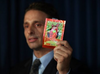 FILE: Kieth Kruskall with the Drug Enforcement Administration, holds up a package of synthetic marijuana at a news conference where it was announced that Federal and New York City authorities had broken up a group that trafficked in synthetic marijuana. /