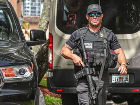 A Secret Service agent is seen in front of former president Donald Trump's Mar-A-Lago home in Palm Beach on Aug. 9, 2022, the day after it was raided by the FBI.