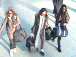 Left to right. British teenagers Amira Abase, Kadiza Sultana and Shamima Begum walk with luggage at Gatwick Airport, south of London, on their way to joining the Islamic State group in Syria on February 17, 2015.