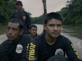 Bitaté Uru-eu-wau-wau (far right) leads a patrol in his ancestral lands.