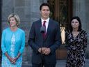 Public Services and Procurement Minister Helena Jaczek (left) and Federal Economic Development Agency for Southern Ontario Minister Filomena Tassi look on as Prime Minister Justin Trudeau responds to a question following a cabinet shuffle at Rideau Hall, Wednesday, August 31, 2022 in Ottawa.