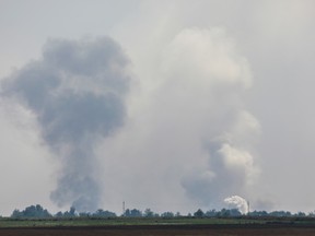 Smoke viewed rising above an alleged explosion in the village of Mayskoye in the Dzhankoi district, Crimea, August 16, 2022.