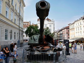Members of the public look around some destroyed Russian tanks in the city centre on August 22, 2022 in Lviv, Ukraine. August 24 marks six months since Russia launched its large-scale invasion of Ukraine.