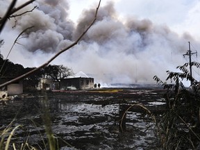 Smoke continues to billow from a days-long, deadly fire at a large oil storage facility in Matanzas, Cuba, Tuesday, Aug. 9, 2022. The fire was triggered by lighting at one of the facility's eight tanks late Friday, Aug. 5th.