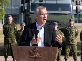 NATO Secretary General Jens Stoltenberg speaks during a joint-press conference with Canadian Prime Minister Justin Trudeau at the Royal Canadian Air Force base in Cold Lake on Aug. 26.
