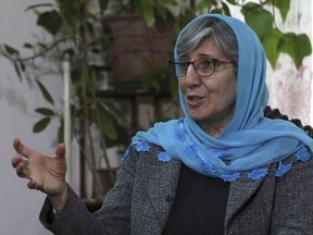 FILE - Sima Samar, a prominent activist and physician, who has been fighting for women's rights in Afghanistan for the past 40 years, gives an interview to The Associated Press, at her house in Kabul, Afghanistan, on March 6, 2021. A year after the Taliban takeover of Afghanistan, prominent Afghan rights activist Sima Samar is still heartbroken over what happened to her country.