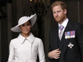 Prince Harry and Meghan, Duchess of Sussex leave after a service of thanksgiving for the reign of Queen Elizabeth II at St Paul's Cathedral in London, Friday, June 3, 2022 on the second of four days of celebrations to mark the Platinum Jubilee.