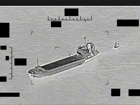 This photo released by the U.S. Navy shows the Iranian Revolutionary Guard ship Shahid Bazair, left, towing a U.S. Navy Saildrone Explorer in the Persian Gulf on Tuesday, Aug. 30, 2022. The U.S. Navy's Mideast-based 5th Fleet said Tuesday that Iran's paramilitary Revolutionary Guard seized and later let go of a U.S. sea drone in the Persian Gulf. Iran did not immediately acknowledge the incident, though it comes amid heightened tensions over Tehran's tattered nuclear deal with world powers.