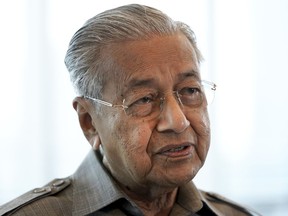 FILE - In this Sept. 4, 2020, file photo, former Prime Minister Mahathir Mohamad speaks during an interview with The Associated Press in Kuala Lumpur. Mahathir, 97, was hospitalized Wednesday, Aug. 31, 2022, after testing positive for COVID-19, his office said.