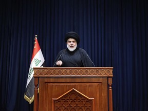 FILE - Influential Shiite cleric Muqtada al-Sadr, makes a speech calling on his supporters to withdraw from the capital's government quarter, from his house in Najaf, Iraq, Tuesday, Aug. 30, 2022. Normal life crept back in Baghdad Wednesday after a bloody 24 hours when the supporters of al-Sadr clashed with Iraqi security forces inside the heavily fortified Green Zone, the seat of Iraq's government. At least 30 people, both al-Sadr's loyalists and Iraqi security forces, were killed, and over 400 people were wounded.