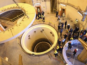 FILE - In this photo released by the Atomic Energy Organization of Iran, technicians work at the Arak heavy water reactor's secondary circuit, as officials and media visit the site, near Arak, 150 miles (250 kilometers) southwest of the capital Tehran, Iran, Dec. 23, 2019. Iranian officials now speak openly about something long denied by Tehran as it enriches uranium at its closest-ever levels to weapons-grade material: Iran is ready to build an atomic weapon at will. This could be put to the test Thursday, Aug. 4, 2022, as Iran, the U.S. and the European Union prepare for a snap summit that appears to be a last-ditch effort in Vienna to revive Tehran's tattered nuclear deal. (Atomic Energy Organization of Iran via AP, File)
