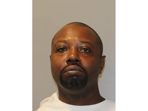 In this photo provided by the Kansas City, Missouri police department, Samuel Avery is pictured in a booking photo dated Sunday, Aug. 7, 2022 in Kansas City, Missouri. Avery has been charged with shooting and killing his neighbor following an argument over lawn mowing, bringing to an end years of hostility between the two, officials said. (Kansas City Missouri Police Department via AP)
