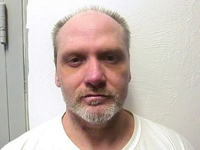 FILE - This Feb. 5, 2021, photo provided by the Oklahoma Department of Corrections shows James Coddington. The Oklahoma Board of Pardon and Parole is recommending clemency for death row inmate Coddington. The board voted 3-2 on Wednesday, Aug. 3, 2022, to recommend Gov. Kevin Stitt grant clemency to Coddington, who was convicted and sentenced to die for killing 73-year-old Albert Hale inside Hale's home in Choctaw in 1997. (Oklahoma Department of Corrections via AP, File)