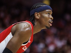 Shai Gilgeous-Alexander (2) looks to the basket during first half FIBA international men's World Cup basketball qualifying action against Dominican Republic, in Hamilton on Friday, July 1, 2022. Gilgeous-Alexander headlines Canada's men's basketball roster for the next World Cup qualifying window.THE CANADIAN PRESS/Cole Burston