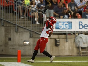 Calgary Stampeders running back Peyton Logan (20) celebrates after scoring a touchdown against the Toronto Argonauts during first half CFL football action in Toronto on Saturday, August 20, 2022.