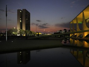FILE - Planalto presidential palace, right, and the National Congress building during the sunset in Brasilia, Brazil, Monday, Sept. 6, 2021. Samuel Vieira de Souza, a retired Army colonel, has been removed from his position of director of the Brazilian Institute of the Environment and Renewable Natural Resources, IBAMA.