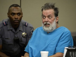 FILE - Robert Dear talks to Judge Gilbert Martinez during a court appearance in Colorado Springs, Colo., on Dec. 9, 2015. A federal judge is holding a hearing on Tuesday, Aug. 30, 2022, to determine if a mentally ill man charged with killing three people and wounding eight others at a Planned Parenthood clinic in 2015 should be forcibly medicated so he can be put on trial.
