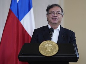 Colombian President Gustavo Petro gives a joint press conference with Chile's President Gabriel Boric at the presidential Narino Palace in Bogota, Colombia, Monday, Aug. 8, 2022.