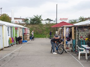 Ontario's mayors, police leaders and businesses are pushing the province for more help to deal with the growing homelessness and opioid crisis that is gripping cities both big and small. A general view of the "A Better Tent City" community In Kitchener, Ontario, on Thursday October 14, 2021. The community provides small cabins set up as an alternative to the homeless shelter system in the area.