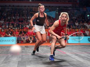 Canada's Hollie Naughton in action against England's Georgia Kennedy (right) in the women's singles gold medal squash match at the University of Birmingham Hockey and Squash Centre on day six of the 2022 Commonwealth Games in Birmingham, Wednesday August 3, 2022. Naughton, who became the first Canadian woman to ever climb the medal podium in squash at the Commonwealth Games, will carry Canada's flag in the closing ceremony.THE CANADIAN PRESS/Zac Goodwin - Press Association