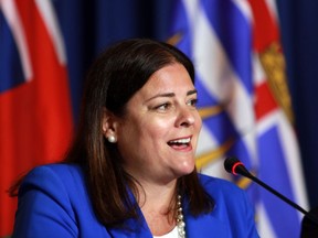 Manitoba Premier Heather Stefanson responds to a question from the media on the final day of the summer meeting of Canada's Premiers at the Fairmont Empress in Victoria on July 12, 2022.