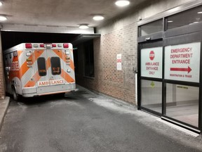 An ambulance is parked at the emergency department at the Lakeridge Health hospital in Bowmanville, Ont. on Wednesday January 12, 2022. Ontario's health minister would not rule out further privatization in health care among a number of possibilities being considered as the province deals with major staff shortages in hospitals.THE CANADIAN PRESS/Doug Ives