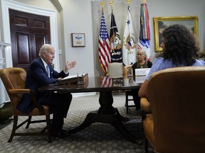 President Joe Biden speaks during a meeting with state and local elected officials about reproductive health care, in the Roosevelt Room of the White House, Friday, Aug. 26, 2022, in Washington. Mayor Elaine O'Neal of Durham, N.C., second from right, and County Judge Lina Hidalgo of Harris County, Texas, right, listen.