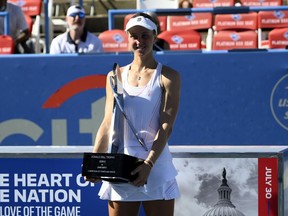 Liudmila Samsonova, of Russia, poses with the trophy after she won the final at the Citi Open tennis tournament against Kaia Kanepi, of Estonia, Sunday, Aug. 7, 2022, in Washington.
