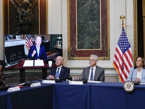 President Joe Biden speaks virtually during the first meeting of the interagency Task Force on Reproductive Healthcare Access in the Indian Treaty Room in the Eisenhower Executive Office Building on the White House Campus in Washington, Wednesday, Aug. 3, 2022. From left, White House Domestic Policy Adviser Susan Rice, Homeland Security Secretary Alejandro Mayorkas, Attorney General Merrick Garland and Vice President Kamala Harris.