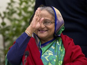 FILE - Bangladeshi Prime Minister Sheikh Hasina greets the gathering during an interaction with journalists after official election results gave her a third straight term, in Dhaka, Bangladesh, Dec. 31, 2018. Hasina on Wednesday, Aug. 17, 2022, told a visiting U.N. official that hundreds of thousands of Rohingya refugees must go back to their ancestral home in Myanmar from crowded camps in neighboring Bangladesh.
