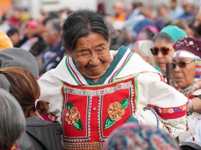 An Indigenous elder smiles as she leaves the crowd while Pope Francis gives an apology during a public event in Iqaluit, Nunavut on Friday, July 29, 2022.