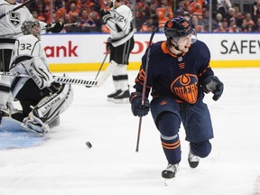 Los Angeles Kings' goalie Jonathan Quick (32) looks on as Edmonton Oilers' Kailer Yamamoto (56) celebrates a goal during second period of first round, game one NHL playoff action in Edmonton, Monday, May 2, 2022.
