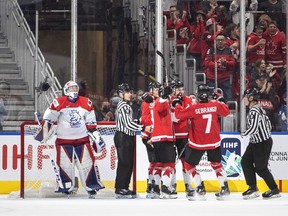 Canada celebrates a goal as Czechia goalie Pavel Cajan (1) looks on during third period IIHF World Junior Hockey Championship semifinal action in Edmonton on Friday August 19, 2022.