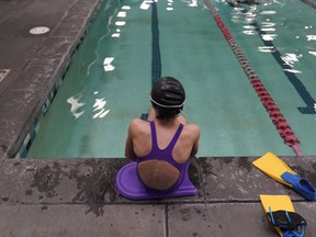 FILE - A 12-year-old transgender swimmer waits by a pool on Feb. 22, 2021, in Utah. Transgender kids in Utah will be not be subjected to sports participation limits at the start of the upcoming school year after a judge delayed the implementation of a statewide ban passed earlier this year. Judge Keith Kelly's decision Friday, Aug. 19, 2022, to put the law on hold until a legal challenges is resolved came after he recently rejected a request by Utah state attorneys to dismiss the case.