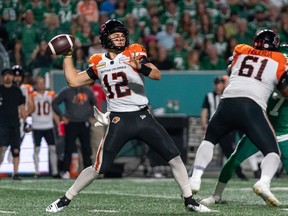 BC Lions quarterback Nathan Rourke (12) looks downfield before throwing against Saskatchewan Roughriders during the second quarter of CFL football action in Regina on Friday, August 19, 2022.