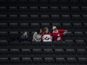 Odd summer timing and an ongoing sexual assault scandal at Hockey Canada could be the reason thousands of tickets to the World Junior Hockey Championship are still available on the eve of the tournament, says an Edmonton professor. Fans take a selfie as they watch United States take on Finland during first period IIHF World Junior Hockey Championship exhibition action in Edmonton on Thursday, December 23, 2021.